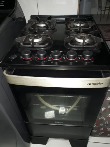 Fogão semi novo com mesa de vidro 4 bocas Mueler R$500,00