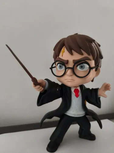 Boneco Harry Potter 22cm + luminária