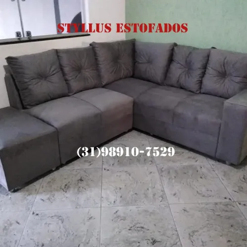 Sofá de canto estofado cinza