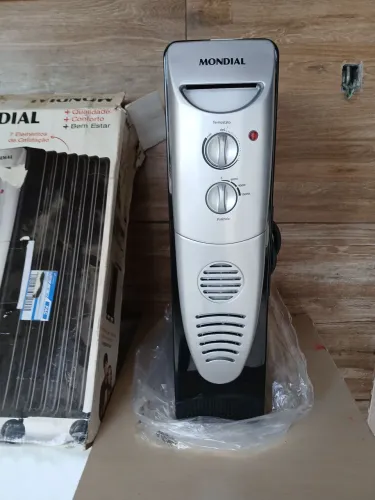 Aquecedor a oleo mondial A06 1500w novo tensão 220v e forno elétrico suggar 127v