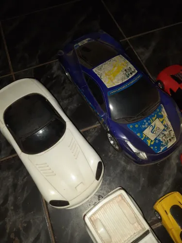 Kit com 8 carrinhos e um transformers