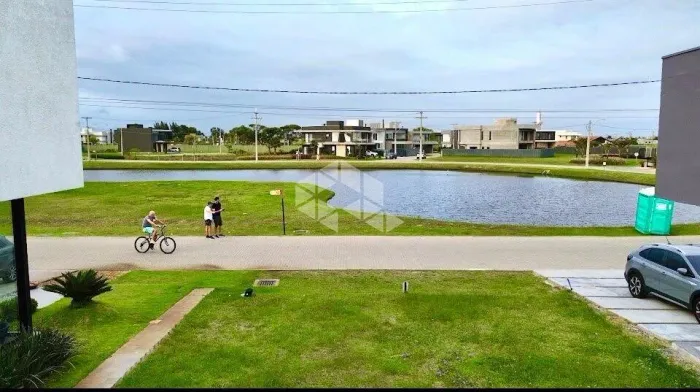 Lote frente lago no Condomínio Sunset em Xangri-lá