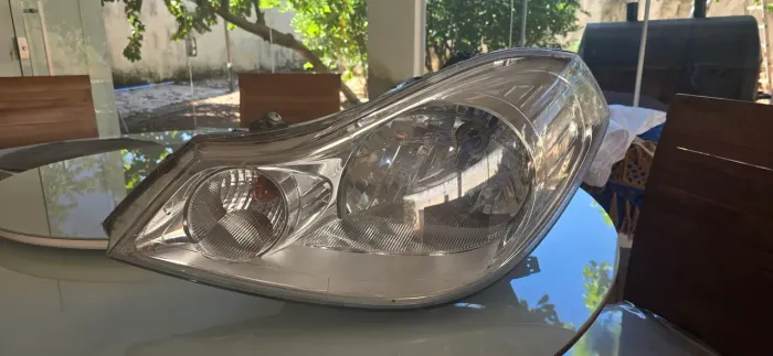 Farol L.Esq ( motorista) Renault Symbol