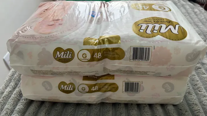 4 pacotes de fralda Mili tamanho G