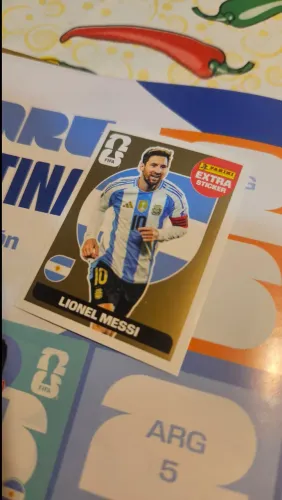 Figurinha Messi Ouro álbum copa 26