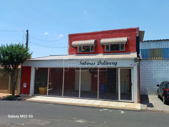 Prédio comercial com moradia na parte de cima.