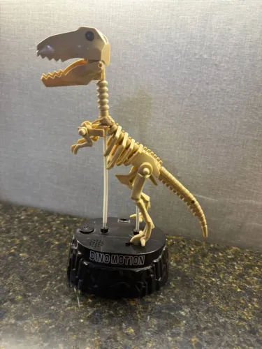 esqueleto de dinossauro dino motion - antigo e raro importado.