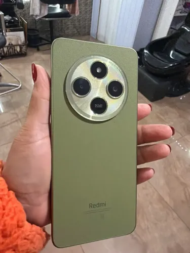 Celular redmi 14C perfeito estado sem risco impecável 1 ano de uso bateria 2 dias de uso 