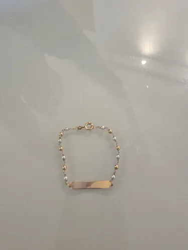 Pulseira infantil ouro 18k com pérolas.