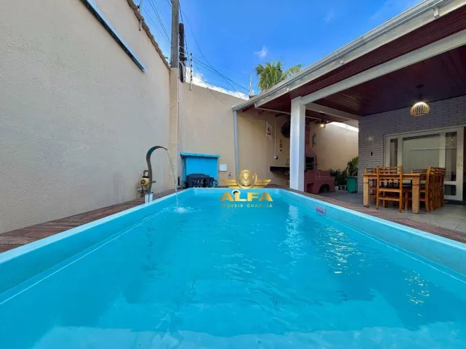 Casa com piscina e área gourmet na Praia da Enseada Alfa Imóveis Guarujá