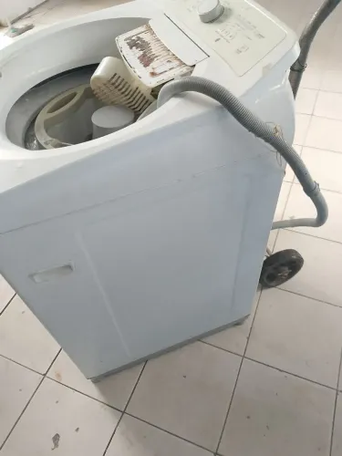 Máquina de lavar com defeito