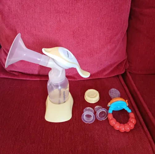 Bomba de tirar leite materno medela manual + alimentador de frutas