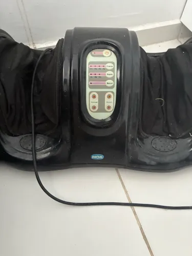 Massageador de pés elétrico.