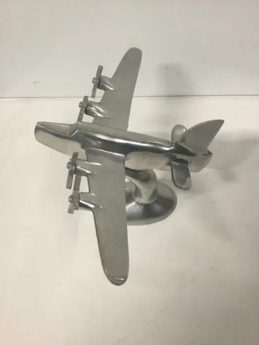 Escultura alumínio polido avião 