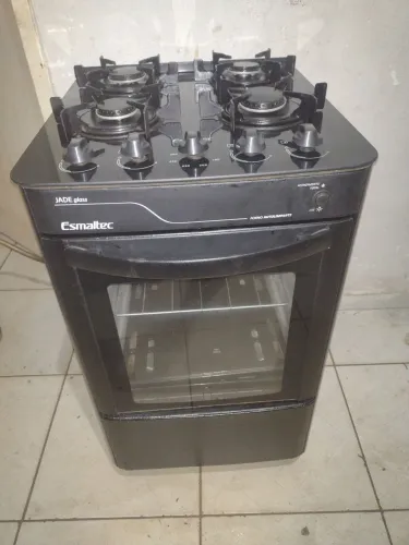 Fogão esmaltec 4 bocas todo de vidro semi novo pra hj temos entrega não e elétrico
