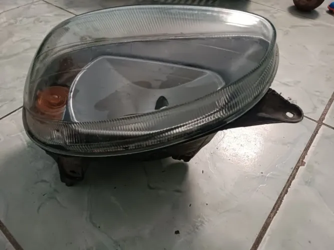 Vendo farol esquerdo e manopla de freio de mão Chevrolet Corsa 