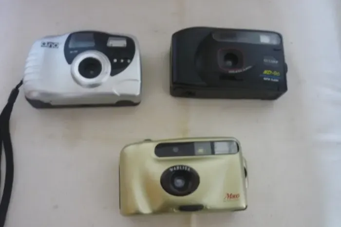 Máquina Fotográfica Ouyama, Aino E Warlisa Leia Descrição