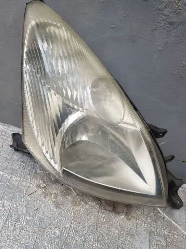 Farol Nissan Livina lado D. Passageiro