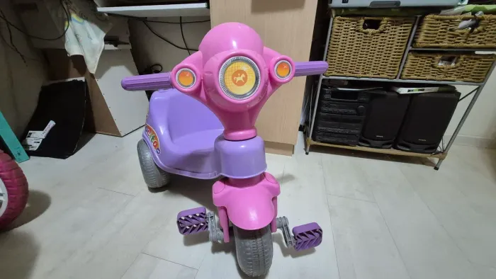 Triciclo calesita menina