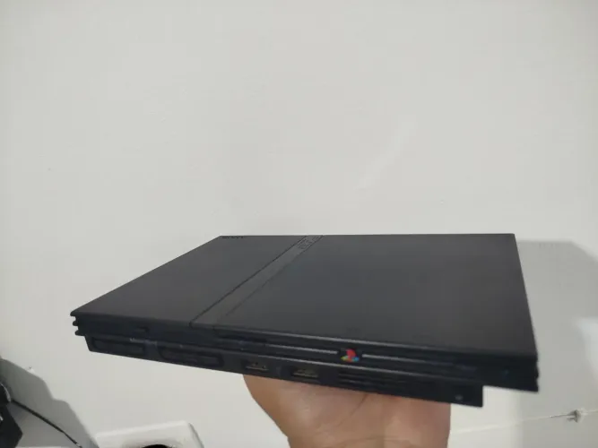 Playstation 2 slim liga não dá imagem tem que bota o botão Power liguei direto pra testar