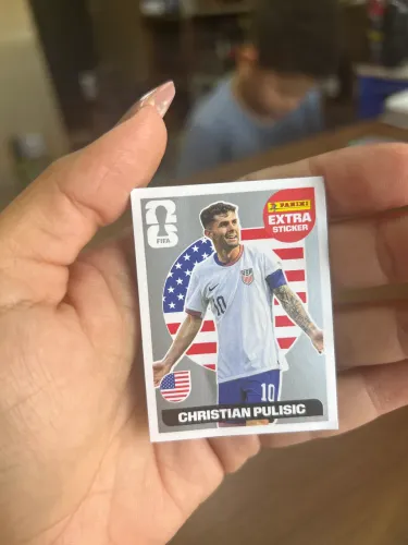 Figurinha Extra Legend Prata (Silver) do jogador Christian Pulisic (Estados Unidos)
