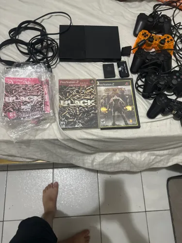 PS2 com cinco controles dois originais Série a 23 jogos um adaptador HDI memo Card