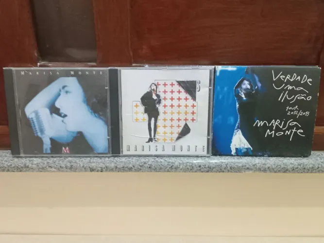 Três CDs de Marisa Monte: MM, Mais e Verdade uma ilusão.