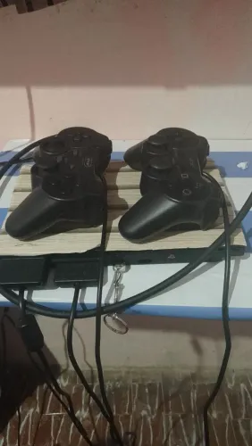 Play2 em perfeito estado com vários jogos