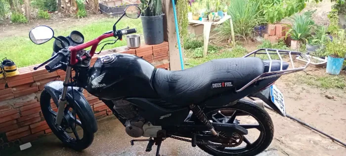 Moto Fan 150 a partida no ponto de transferir placa Mercosul