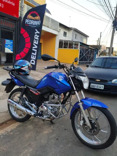 Fan 150 2014, moto impecável nos cromos.