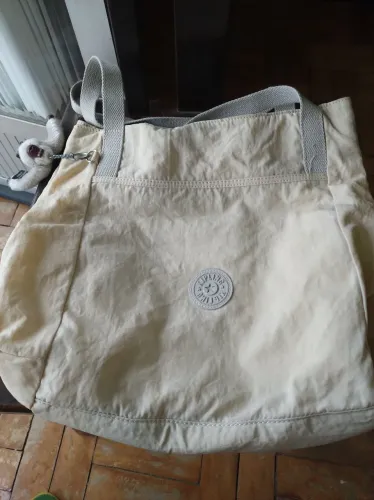 Bolsa klipling com macaco