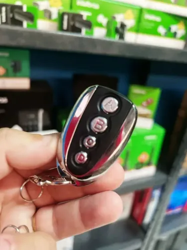 Controle para motor de portão de garagem cromado tipo chaveiro, entregamos já codificado