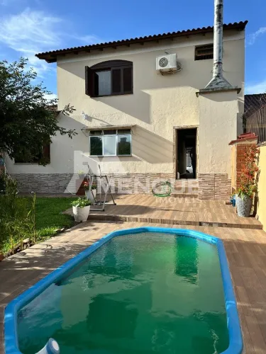Casa residencial com 3 dormitórios e 5 vagas à venda no bairro Parque Santa Fé em Porto Al