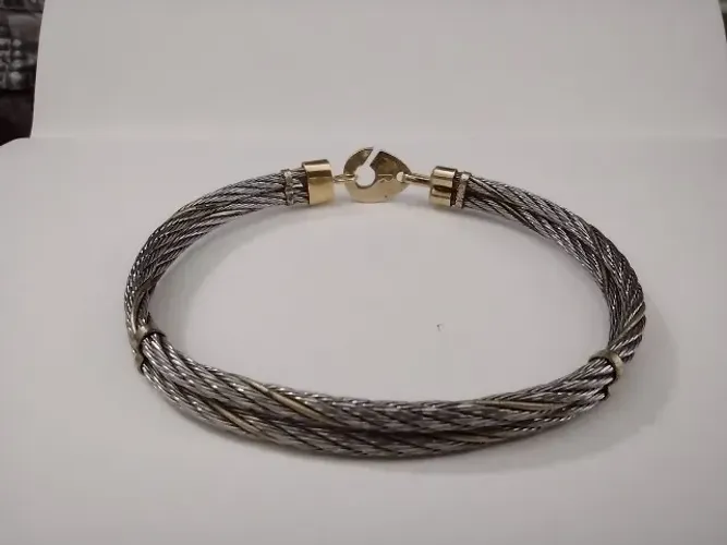 Pulseira em aço e ouro banhado