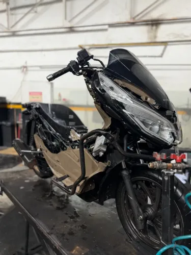 Vaga para ajudante de oficina de moto