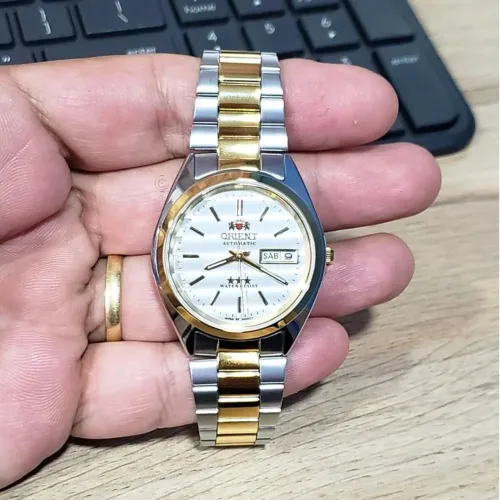 Orient automático dourado