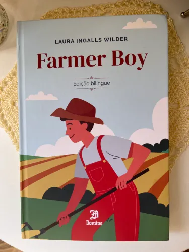 Livro Farmer Boy - Laura Ingalls Wilder (bilíngue inglês/português)
