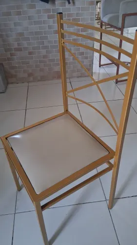 Cadeiras de ferro douradas $140 cada