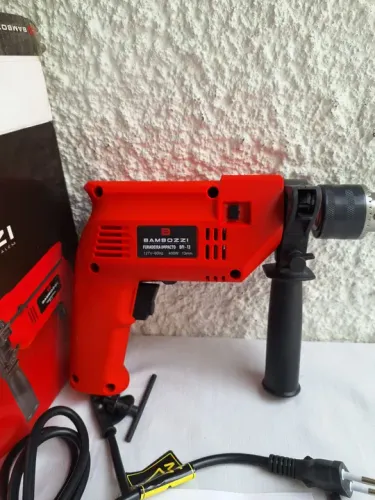 Furadeira de impacto BAMBOZZI 1/2" 13mm, 127v, reversível. Nova, na embalagem.