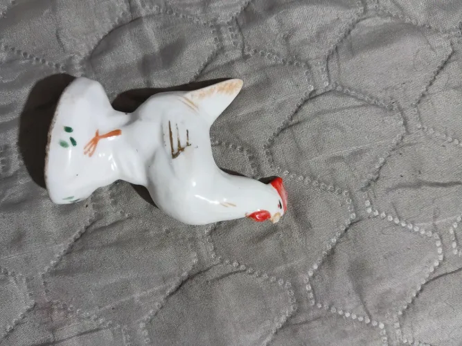 Antigo galo de porcelana