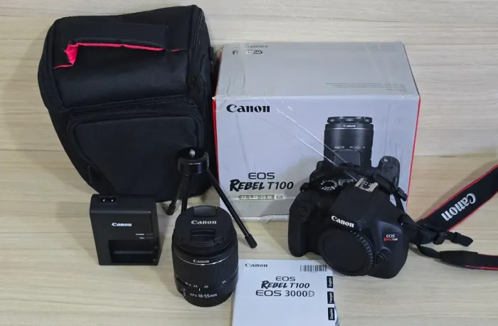 CANON T100 WI-FI + LENTE 18-55MM NOVA, VITRINE SEM USO