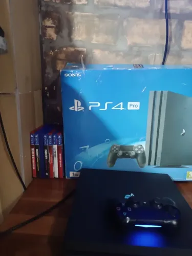 Ps4 pró 1tera semi novo com caixa e 5 jogos 1 controle 