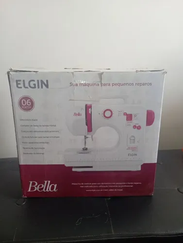 Máquina de costura COM PEQUENO DEFEITO.