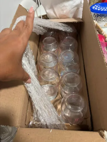 Potes de vidro com tampa de plástico para armazenar leite