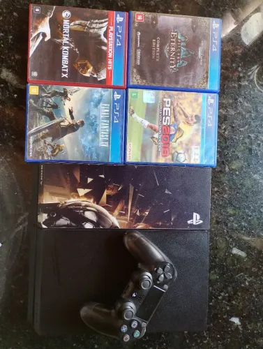 PlayStation 4 FAT com 1 controle e 4 jogos.