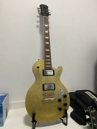 Guitarra Epiphone Lespaul Silver Sparkle com eletrônica e captadores Gibson 