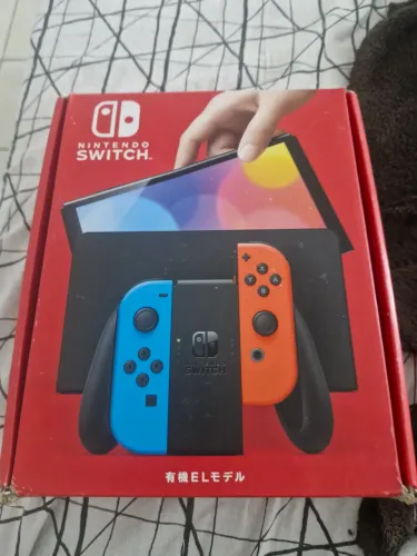 Vendo Nitendo Switch Oled, 64gb versão cor vermelha e azul. Usado menos de um mês.