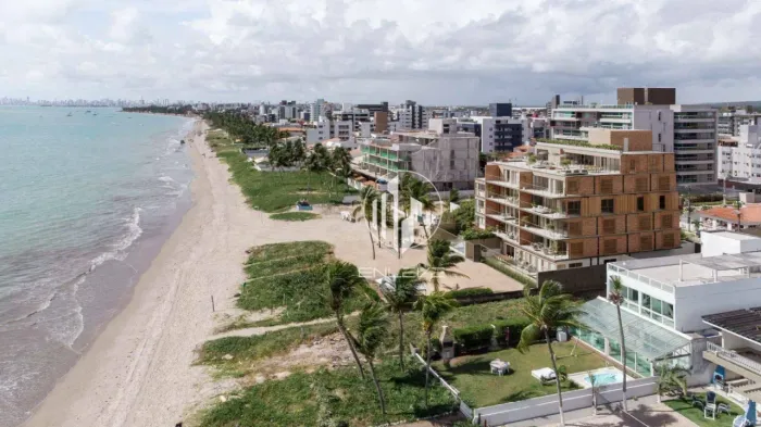 Apartamentos de luxo pé na areia da Praia de Camboinha