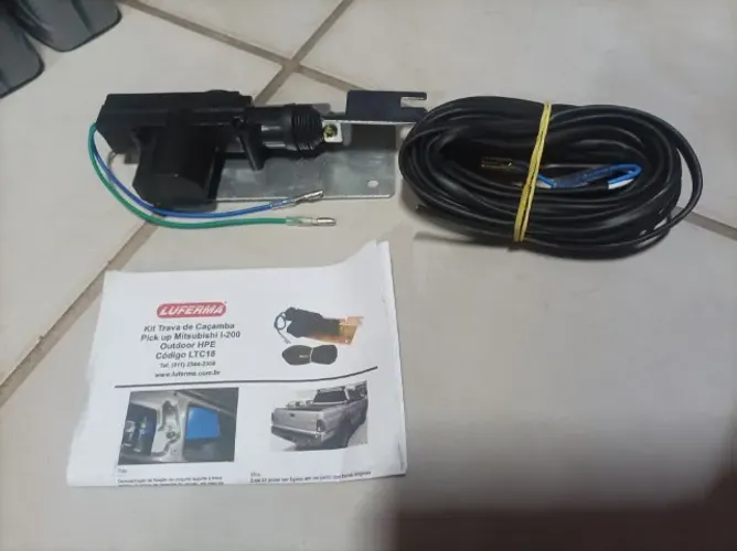 trava caçamba l200