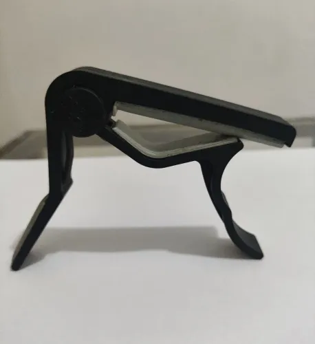 Bapotraste, Braçadeira Para instrumentos de Corda